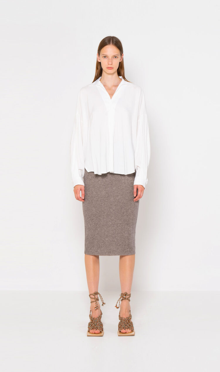 White curved hem blouse